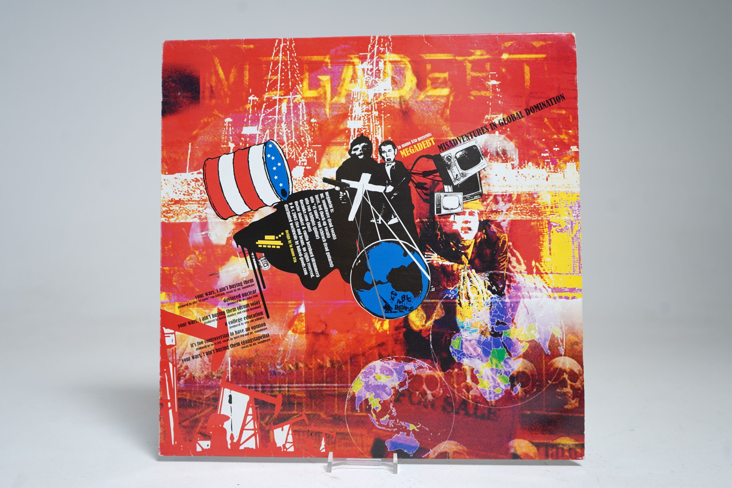 Megadebt - Misadventures in Global Domination (12β³ Vinyl Single)